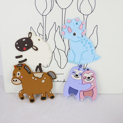 Bebê colorido silicone personalizado Teether com cavalo Dino Shape dos carneiros
