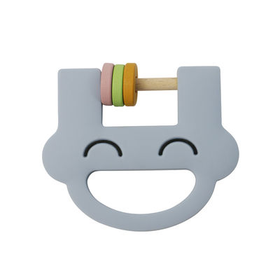 O chocalho bonito Teether do silicone dos brinquedos das crianças do silicone da cara do sorriso com personaliza o ODM do OEM do logotipo