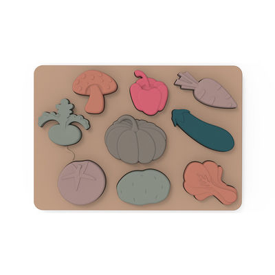 Os vegetais dão forma a Montessori que as serras de vaivém confundem o material do silicone do produto comestível