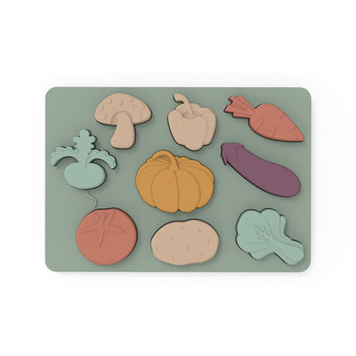 Os vegetais dão forma a Montessori que as serras de vaivém confundem o material do silicone do produto comestível