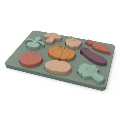 Os vegetais dão forma a Montessori que as serras de vaivém confundem o material do silicone do produto comestível