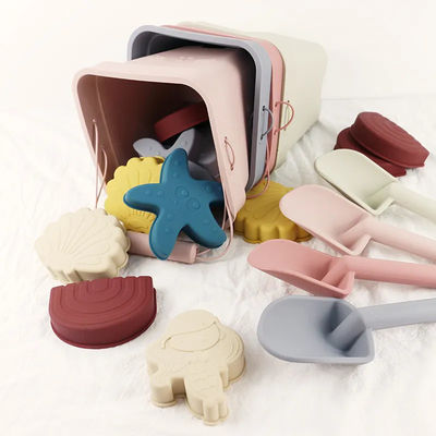 O silicone de flutuação do entretenimento da água de Toy Set Bucket Colorful For da praia do silicone de 6 partes molda o brinquedo da areia da estrela do mar