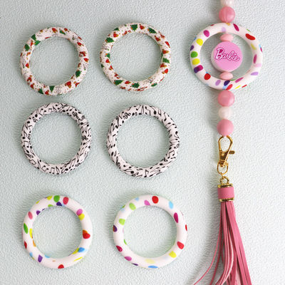 Os grânulos seguros BAIXO MOQ do silicone de 100% imprimiram focals do anel-O do teste padrão para a fatura da corrente chave dos ofícios de DIY