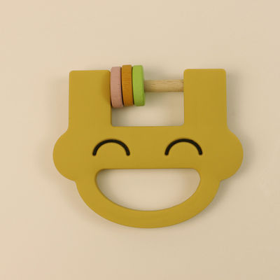 O bebê do silicone que sai os dentes produtos alisa a textura para o conforto